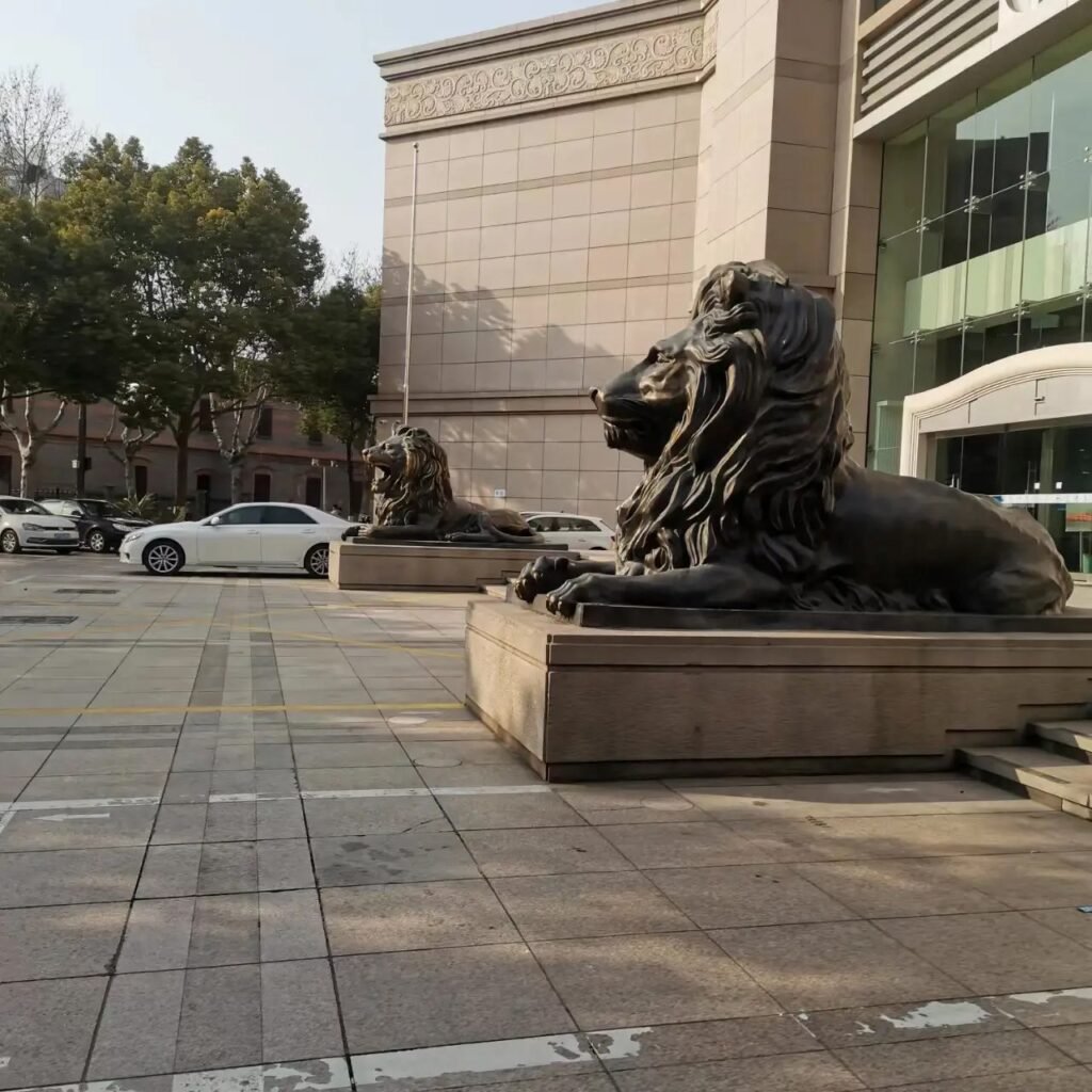 lion statues in front of house