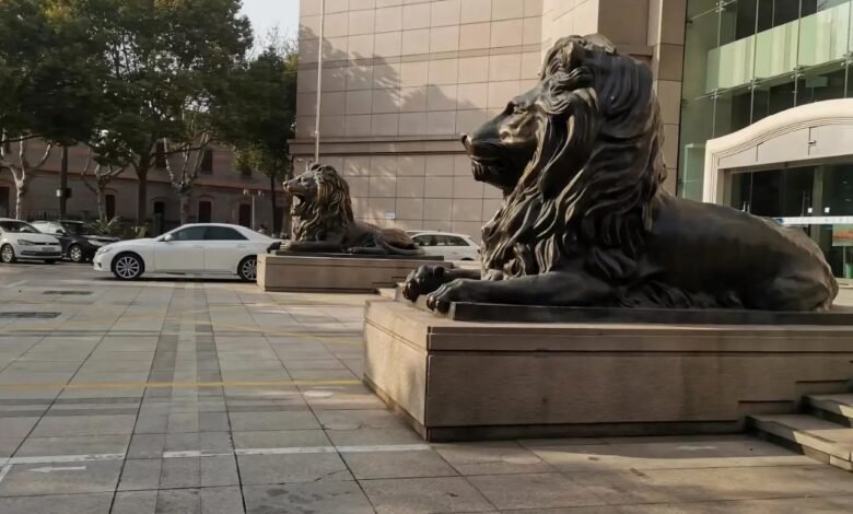 lion statues in front of house